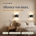 Deux appliques murales sans fil Clarombre allumées au-dessus d'un lit : sans électricien, sans câble